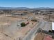 Expansive aerial view showcasing the property's surroundings with desert landscape and distant mountains at 2530 Commercial Dr, Pahrump, NV 89048