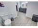 Bathroom featuring grey cabinets, double sinks, modern fixtures and vinyl floors at 2530 Commercial Dr, Pahrump, NV 89048