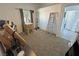 Bedroom with carpet flooring, a window, and a ladder at 2530 Commercial Dr, Pahrump, NV 89048