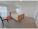 Comfortable bedroom with neutral carpet, light walls, and natural light from the window at 2530 Commercial Dr, Pahrump, NV 89048