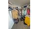 Walk-in closet with organized storage and clothing racks at 2530 Commercial Dr, Pahrump, NV 89048