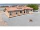 Attractive single-story home featuring desert landscaping, a clay tile roof, and a welcoming front entrance at 2530 Commercial Dr, Pahrump, NV 89048