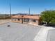 Charming single-story home featuring desert landscaping, a clay tile roof, and a welcoming front entrance at 2530 Commercial Dr, Pahrump, NV 89048