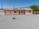 Attractive single-story home boasts large windows, desert landscaping, and a red-tile roof at 2530 Commercial Dr, Pahrump, NV 89048
