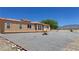 Desert home featuring desert landscaping, a clay tile roof, and mountain views at 2530 Commercial Dr, Pahrump, NV 89048