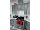 Renovated kitchen features stainless steel appliances, gray cabinets, and modern countertops at 2530 Commercial Dr, Pahrump, NV 89048