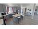 Modern kitchen features gray cabinets, stainless appliances, and a center island with seating at 2530 Commercial Dr, Pahrump, NV 89048