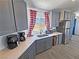 Updated kitchen features gray cabinets, stainless steel appliances, and modern countertops at 2530 Commercial Dr, Pahrump, NV 89048