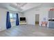 Bright living room with vaulted ceilings, large windows with scenic views, and luxury vinyl plank flooring at 2530 Commercial Dr, Pahrump, NV 89048