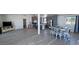Open floor plan living room and kitchen boasts new flooring and modern gray kitchen cabinets at 2530 Commercial Dr, Pahrump, NV 89048