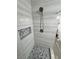 Modern shower with stylish tile work, a built-in niche, and a sleek showerhead at 2530 Commercial Dr, Pahrump, NV 89048