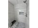 This shower features gray tiled walls, stone tile floor and a built-in niche at 2530 Commercial Dr, Pahrump, NV 89048
