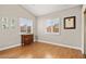 Inviting bedroom with wood floors, shutters, and neutral paint, creating a warm, relaxing atmosphere at 2608 Sun Reef Rd, Las Vegas, NV 89128