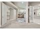 Large bedroom features a cozy fireplace, lots of natural light, and bright white trim at 2608 Sun Reef Rd, Las Vegas, NV 89128