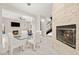 Open concept dining room showcasing modern lighting and access to the fireplace at 2608 Sun Reef Rd, Las Vegas, NV 89128