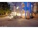 Exterior view features a fire pit, outdoor bar area, tasteful landscaping, and architectural beauty at 2608 Sun Reef Rd, Las Vegas, NV 89128