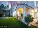 Beautiful exterior with manicured lawn, mature landscaping, and architectural details showcasing elegant curb appeal at 2608 Sun Reef Rd, Las Vegas, NV 89128