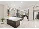 Modern kitchen featuring marble countertops, stainless steel appliances, and custom cabinetry at 2608 Sun Reef Rd, Las Vegas, NV 89128