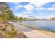 Walking path beside a lake with landscaping and community amenities at 2608 Sun Reef Rd, Las Vegas, NV 89128