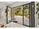 Patio featuring multi-panel patio doors with views of the outdoor landscaping and columns at 2608 Sun Reef Rd, Las Vegas, NV 89128