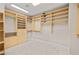 Spacious walk-in closet with custom shelving and drawers, providing ample storage space at 2608 Sun Reef Rd, Las Vegas, NV 89128
