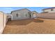 Spacious backyard featuring a covered patio and low-maintenance desert landscaping at 2721 Avril Point St, Las Vegas, NV 89156