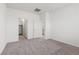 Carpeted bedroom with open closet and attached bathroom at 2721 Avril Point St, Las Vegas, NV 89156