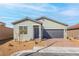 Charming single-story home featuring a two-car garage and desert landscaping at 2721 Avril Point St, Las Vegas, NV 89156