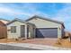 Charming single-story home featuring a two-car garage and desert landscaping at 2721 Avril Point St, Las Vegas, NV 89156