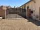 Backyard entrance with metal gate at 2772 Brinkley Manor St, Laughlin, NV 89029