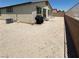 Spacious backyard with low-maintenance gravel landscaping and a patio area at 2772 Brinkley Manor St, Laughlin, NV 89029