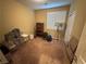 Spare bedroom with a window, carpeted floors, and minimal furnishings at 2772 Brinkley Manor St, Laughlin, NV 89029