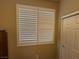 Bedroom window with blinds and a closet door with a neutral color scheme at 2772 Brinkley Manor St, Laughlin, NV 89029