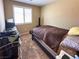 Neutral bedroom with a large window and blinds, and carpeted floors at 2772 Brinkley Manor St, Laughlin, NV 89029