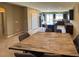 Open-concept dining and kitchen area with a large island at 2772 Brinkley Manor St, Laughlin, NV 89029