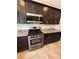 Modern kitchen with stainless steel appliances, granite countertops, and ample cabinet space, perfect for cooking and entertaining at 2772 Brinkley Manor St, Laughlin, NV 89029