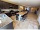 Open kitchen with island seating and stainless steel appliances at 2772 Brinkley Manor St, Laughlin, NV 89029