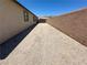Long side yard with dirt and block wall providing ample space at 2772 Brinkley Manor St, Laughlin, NV 89029