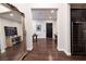 Elegant foyer with hardwood floors, a large mirror, and a view into the kitchen at 29 Costa Tropical Dr, Henderson, NV 89011