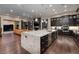 Spacious kitchen with a large island, stainless steel appliances, and an open view to the living area at 29 Costa Tropical Dr, Henderson, NV 89011
