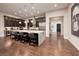 Open concept kitchen with a large island, granite countertops, and stainless steel appliances at 29 Costa Tropical Dr, Henderson, NV 89011