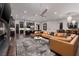 The beautiful living room is situated close to the kitchen and features dark hardwood floors and ample lighting at 29 Costa Tropical Dr, Henderson, NV 89011