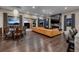 Spacious living room featuring hardwood floors, fireplace and wall of windows for lots of natural light at 29 Costa Tropical Dr, Henderson, NV 89011