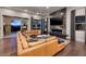 Relax in the living room with marble fireplace, ceiling fan and wall of sliding glass doors to the outdoor area at 29 Costa Tropical Dr, Henderson, NV 89011