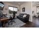 Functional home office with a comfortable sofa, desk, and natural light for a productive workspace at 29 Costa Tropical Dr, Henderson, NV 89011