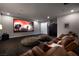 Home theater room with comfortable seating and a large screen for an immersive viewing experience at 29 Costa Tropical Dr, Henderson, NV 89011
