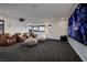 Spacious home theater with comfortable seating and a large screen, designed for immersive entertainment at 29 Costa Tropical Dr, Henderson, NV 89011
