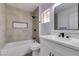 Modern bathroom with a tiled shower and tub combo, and white cabinets at 2905 Legend Dr, Las Vegas, NV 89134