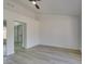 A spacious bedroom with light colored flooring and an open doorway at 2905 Legend Dr, Las Vegas, NV 89134