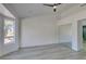 An empty bedroom with hard floors, a window and a mirrored closet at 2905 Legend Dr, Las Vegas, NV 89134